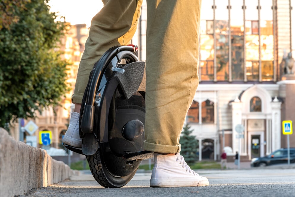 a young woman on electric unicycle (EUC)